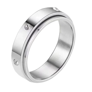 Minimalist spinning stainless steel ring with black groove and three white zircons