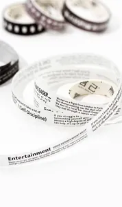Detailed view of white washi tape rolls featuring minimalist English typography for journaling