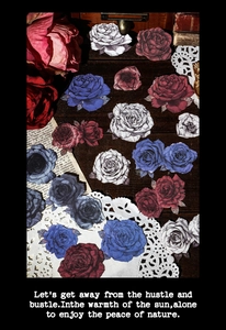 Detailed close-up of vintage rose scrapbooking stickers with intricate die-cut edges