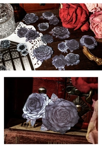 Detailed view of vintage dark purple rose stickers and ephemera for journaling