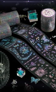 Detailed macro view of laser PET tape featuring rainbow aurora effect and butterfly motifs