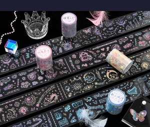 Close-up of PET decorative tape with gold foil laser butterfly and floral motifs