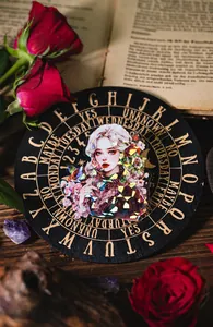 Detail of shell-light PET sticker featuring dark goddess and red roses for journaling
