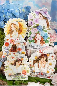 Detail of floral PET stickers with gold foil accents on a fresh garden backdrop