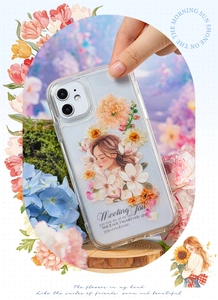 Macro detail of transparent iPhone case with floral girl illustration and poetic text