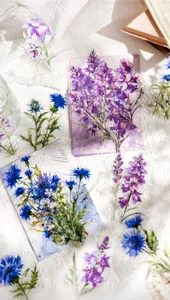Detailed view of floral PET stickers with lavender and cornflower designs on lace background