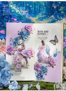 Detail of vintage girl stickers with rose and butterfly patterns on bullet journal pages