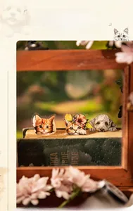 Detail of PET decorative tape featuring hand-drawn cat and dog illustrations on vintage books