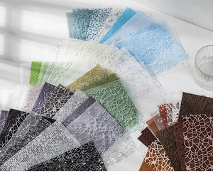 Artistic layout of Morandi-toned textured craft paper and mesh for DIY scrapbooking