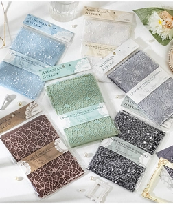 Detailed close-up of vintage Athenian style paper and lace materials for scrapbooking