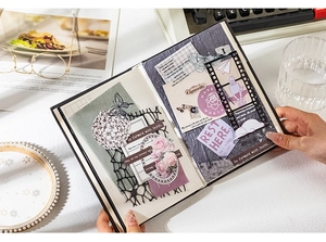 Detailed retro collage on black grid notebook with vintage floral and butterfly elements