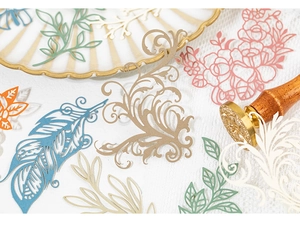Detailed view of hollow cut lace paper featuring vintage floral and feather patterns