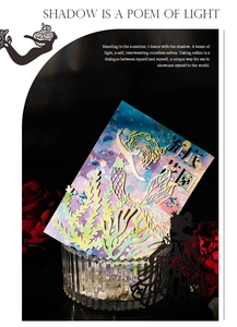 Detail of laser-cut mermaid paper silhouette with Undersea World theme in glass