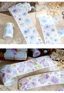 Close-up of vintage floral washi tape with watercolor blue roses and butterflies