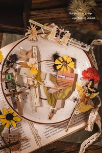 Close-up of vintage PET stickers with floral and butterfly patterns in a ceramic dish