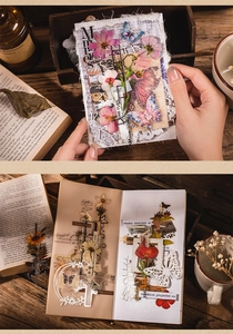 Detailed close-up of vintage floral scrapbooking stickers and butterfly paper cutouts
