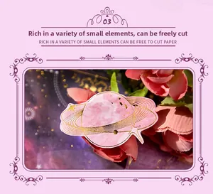 Détail de papier scrapbooking céleste rose avec motifs d'étoiles en feuille d'or