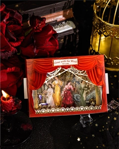 Close-up of Gone with the Wind vintage theater stickers with retro rose and candle