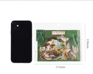 Wizard of Oz theme sticker pack dimensions shown next to a smartphone for scale