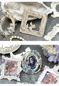 Detail of vintage Baroque style resin frames with angel relief and floral carvings