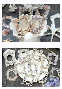 Macro detail of vintage hollow DIY scrapbook frames with sea shells and floral motifs