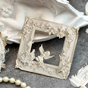 European vintage white relief picture frame with decorative angel and floral carvings