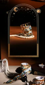 Close-up of vintage decorative tape with mystical castle illustrations for candle DIY