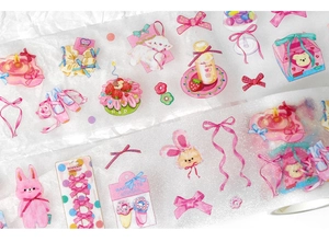 Close-up of glitter PET tape showing cute pink rabbit and bowknot patterns for journaling