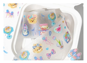 Close-up of glitter PET tape featuring cute puppy and floral hand-drawn illustrations