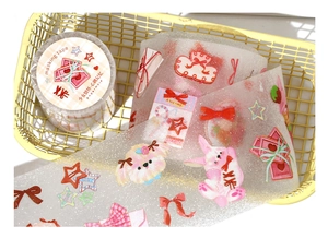 Detail of glitter PET tape featuring cute pink rabbits and bows for DIY journaling