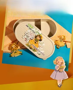 Close-up of a fairy-tale themed beige bento box with floral girl stickers and dual compartments