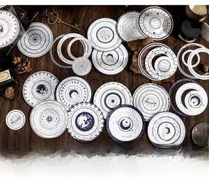 Macro shot of vintage astronomical circle stickers with moon phases and celestial designs