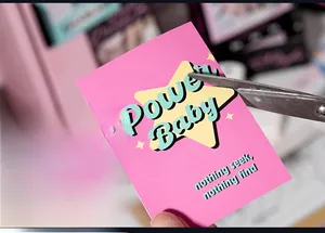 Detail showing DIY cut of a pink Power Baby decorative scrapbooking sticker sheet