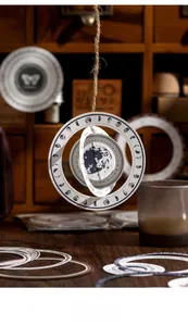 Detail of vintage astronomical paper craft showing phases of moon and rotary date dial