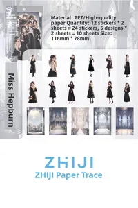 Detail of vintage fashion stickers featuring black and grey anime girl motifs for scrapbooking