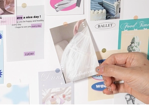 Close-up of vintage American style scrapbook stickers with pastel tones and matte texture
