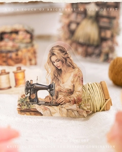 Close-up of vintage PET sticker showing a woman sewing with floral decorative borders
