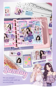 Detail of anime girl illustration stickers on a loose-leaf notebook with soft lighting