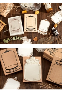 Macro shot of vintage wooden stamps with glass bottle motifs and decorative paper tags