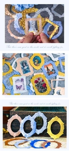 Macro detail of retro embossed frame stickers with golden baroque textures for DIY journaling