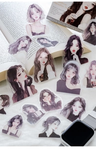 Flat lay of matte PET stickers from Heartbeat Paradise Series on an open book