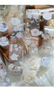 Detail of vintage flower PET tapes showing rose and lily designs for scrapbooking DIY