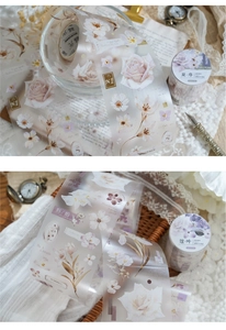 Detail of vintage PET floral tape with delicate rose and daisy patterns for scrapbooking