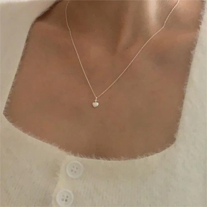 Close-up of heart necklace with opal texture pendant on adjustable 925 silver chain