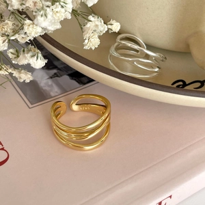 Detailed macro view of S925 sterling silver multi-layer rings with engraved hallmark