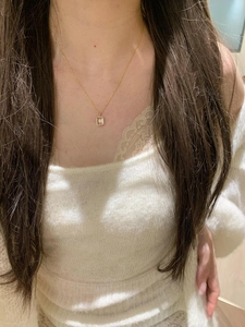 Close-up of S925 silver snowflake crystal pendant necklace worn on a woman's collarbone