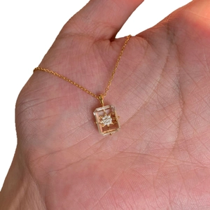 S925 silver snowflake necklace with clear crystal pendant on a gold O-chain necklace