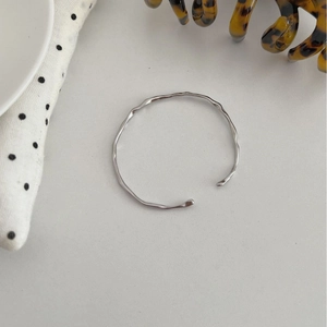 Minimalist S925 silver open bangle with irregular liquid metal texture and glossy finish