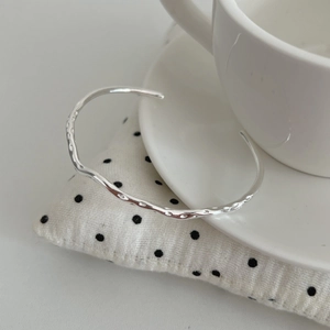 Irregular liquid metal ripple S925 silver cuff bracelet with a hammered texture finish