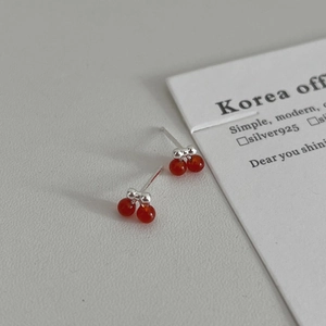 Minimalist S925 sterling silver cherry stud earrings with deep red beads on gray texture